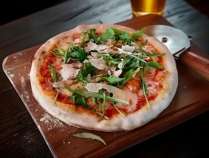 Pizza styled with cozy rustic aesthetic - dark wood backdrop