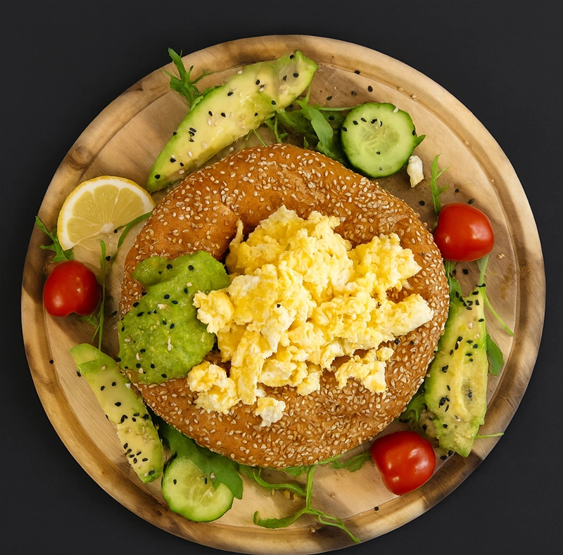 Bagel styled with studio aesthetic - black backdrop